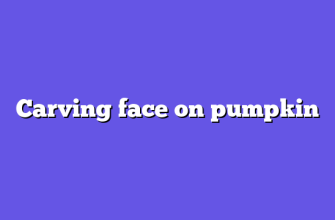 Carving face on pumpkin